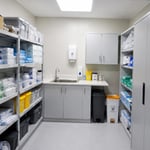 Clinical storage and utility room inside a permanent modular GP surgery with secure medical supply storage, worktops and healthcare support facilities.