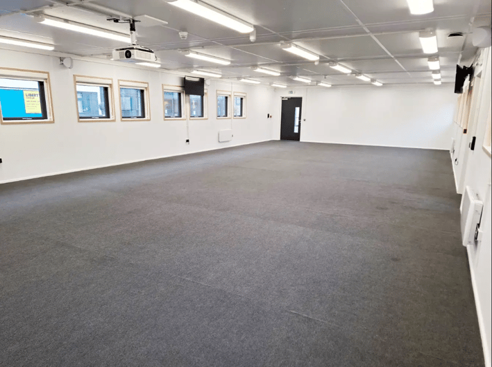The inside of an empty modular school building.