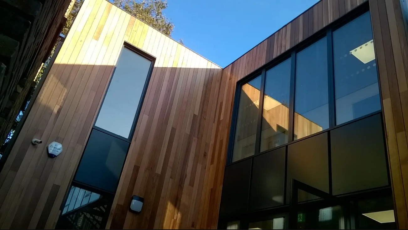 Bespoke prefab commercial building with timber cladding and large glazed windows