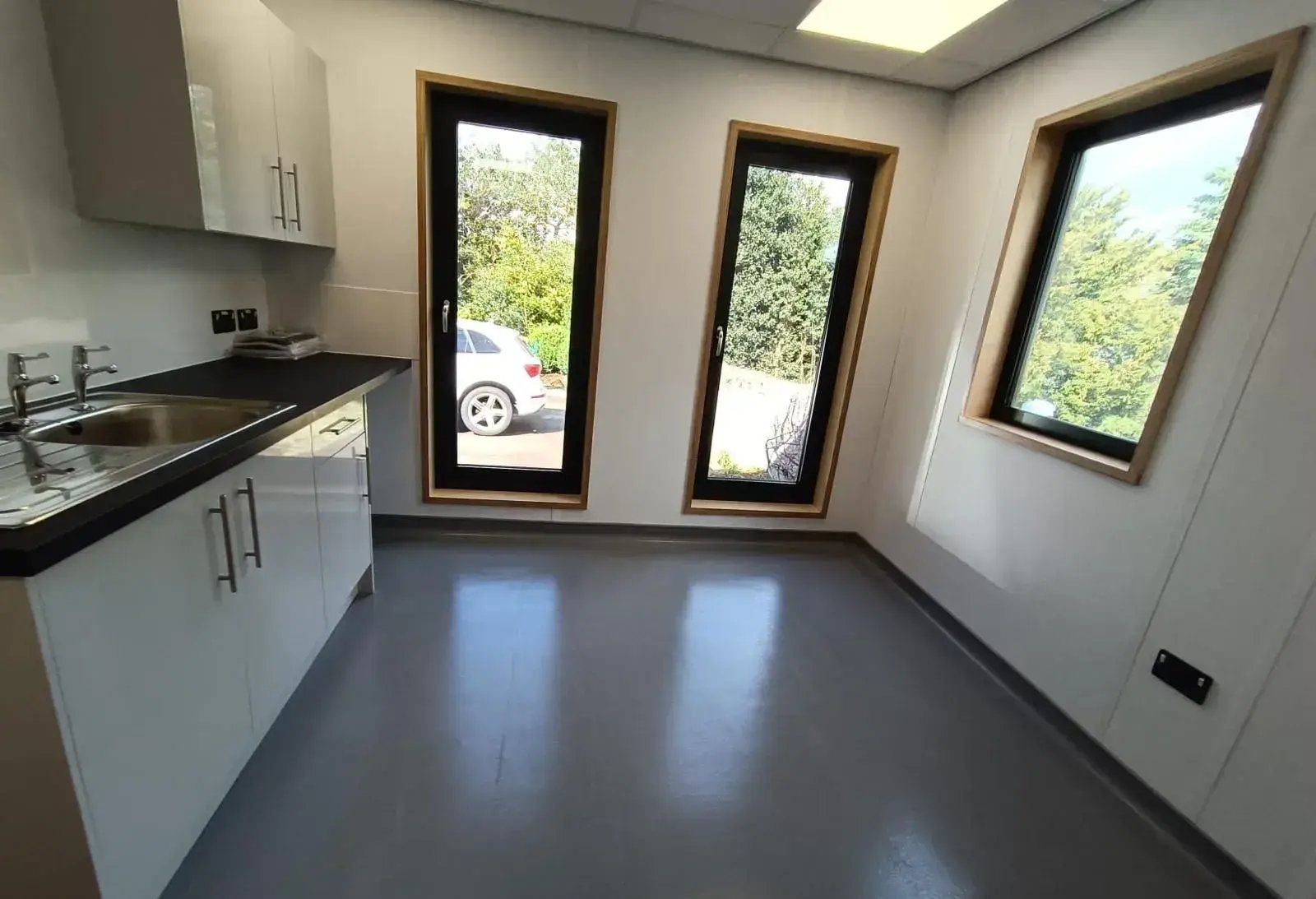 Purpose-built treatment room within a modular veterinary clinic building