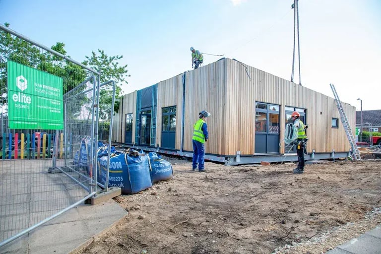 Modular construction building installation in the UK demonstrating prefabricated building compliance and site assembly.