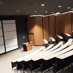 Modern modular lecture theatre with tiered seating designed for university lectures, seminars and presentations.
