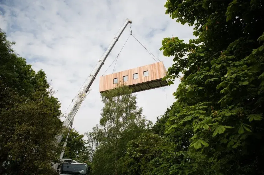 A modular healthcare building being installed to create flexible community healthcare.