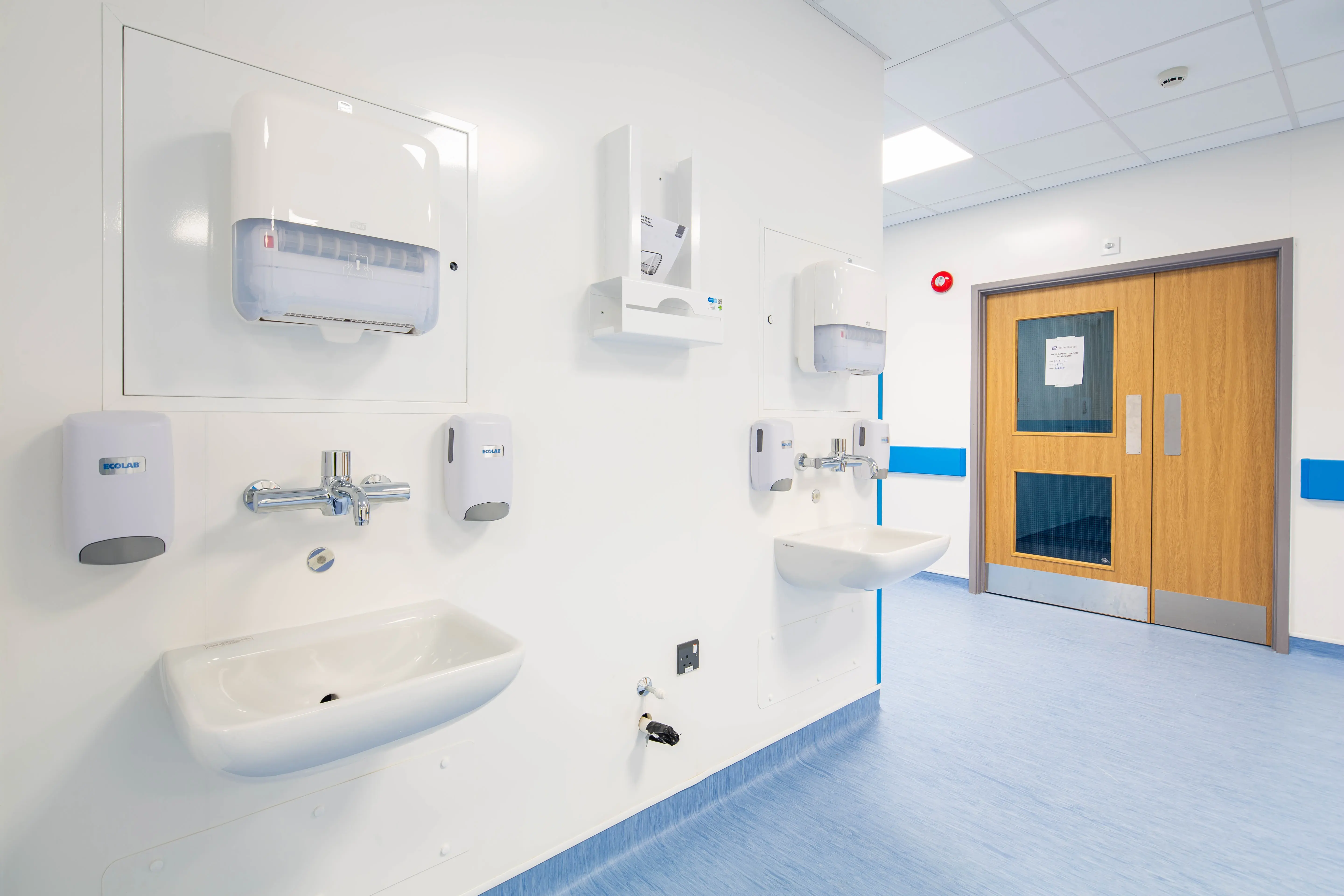 Clinical handwashing stations inside a permanent modular hospital building designed to support infection control