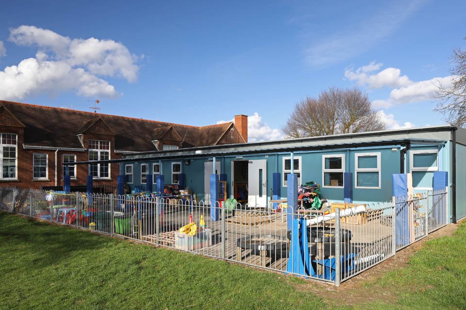 A view of a modular classroom and outside play area at Stanway Primary School Early Years Education